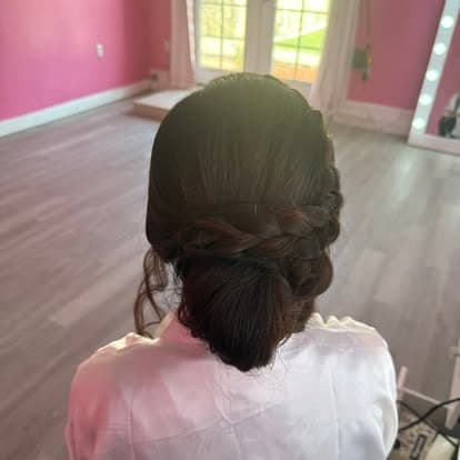 Low bun hairstyle detail for bridal makeup appointment