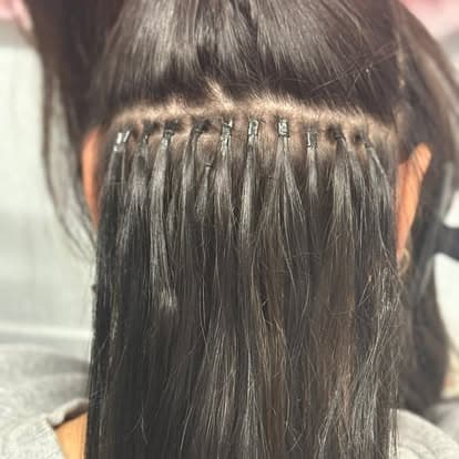 Hair extension installation detail for fantasy hair styling